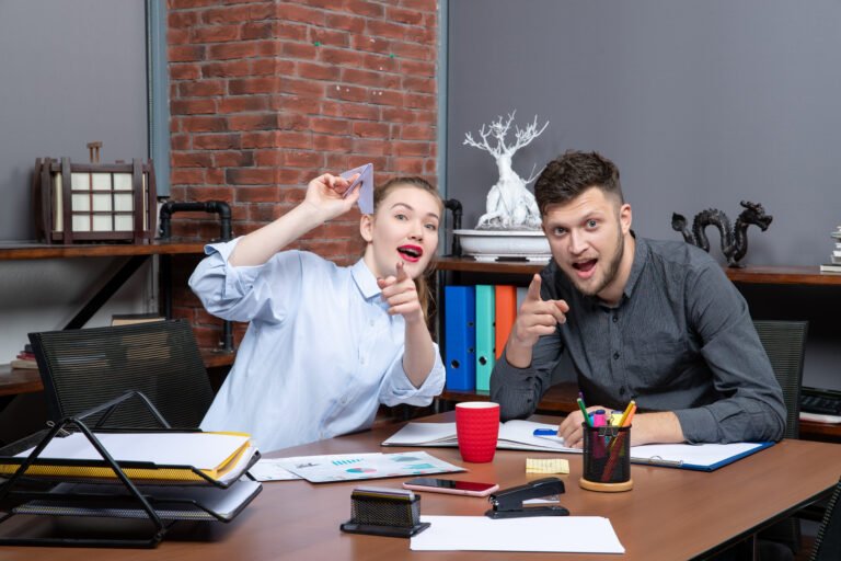 top-view-pencil-pushers-concentrated-something-with-surprised-facial-expression-office