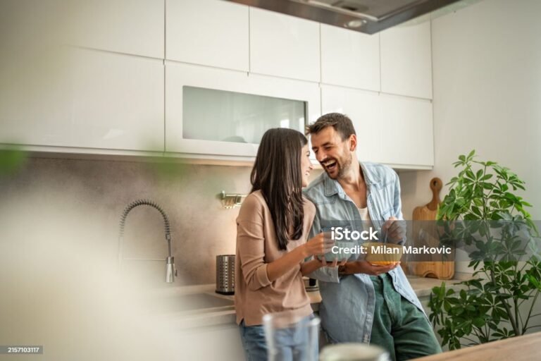 New Love Milestone - a couple in love enjoying breakfast in their new apartment